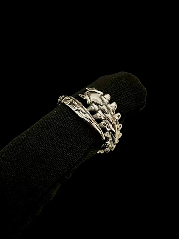 Y2K goth couple rings with oxidized steel spikes and interlocking claw designs