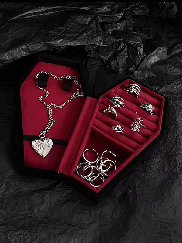 Y2K gothic jewelry box with oxidized steel hinges, velvet-lined compartments, and occult engravings