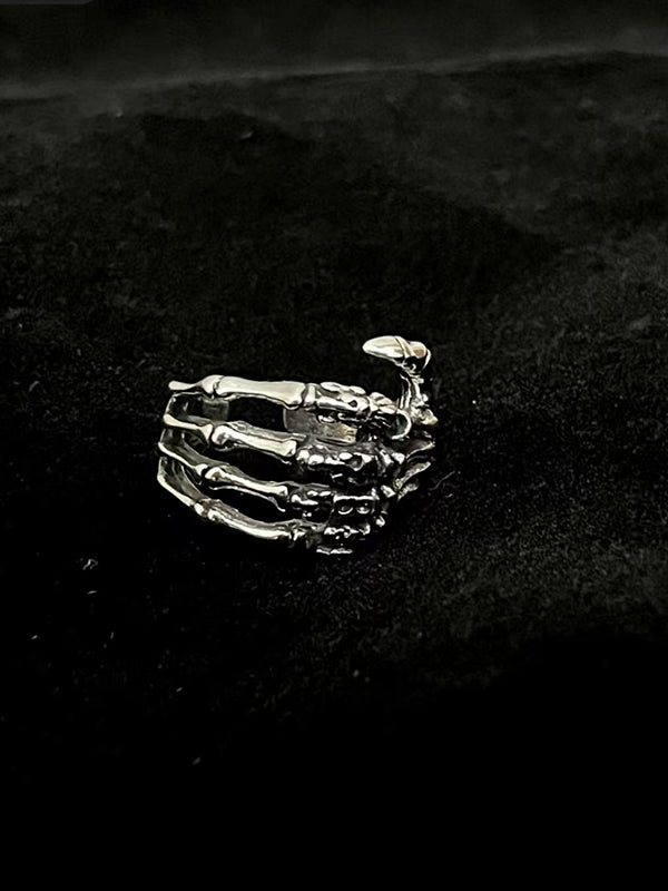 Y2K skull ring jewelry for men with oxidized steel skeleton hand and chain details