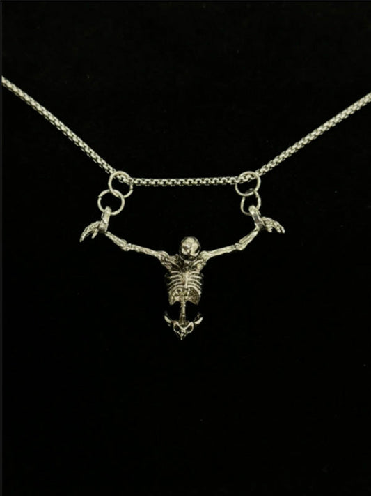 Y2K skull pendant necklace with oxidized steel chain and Gothic cathedral charm