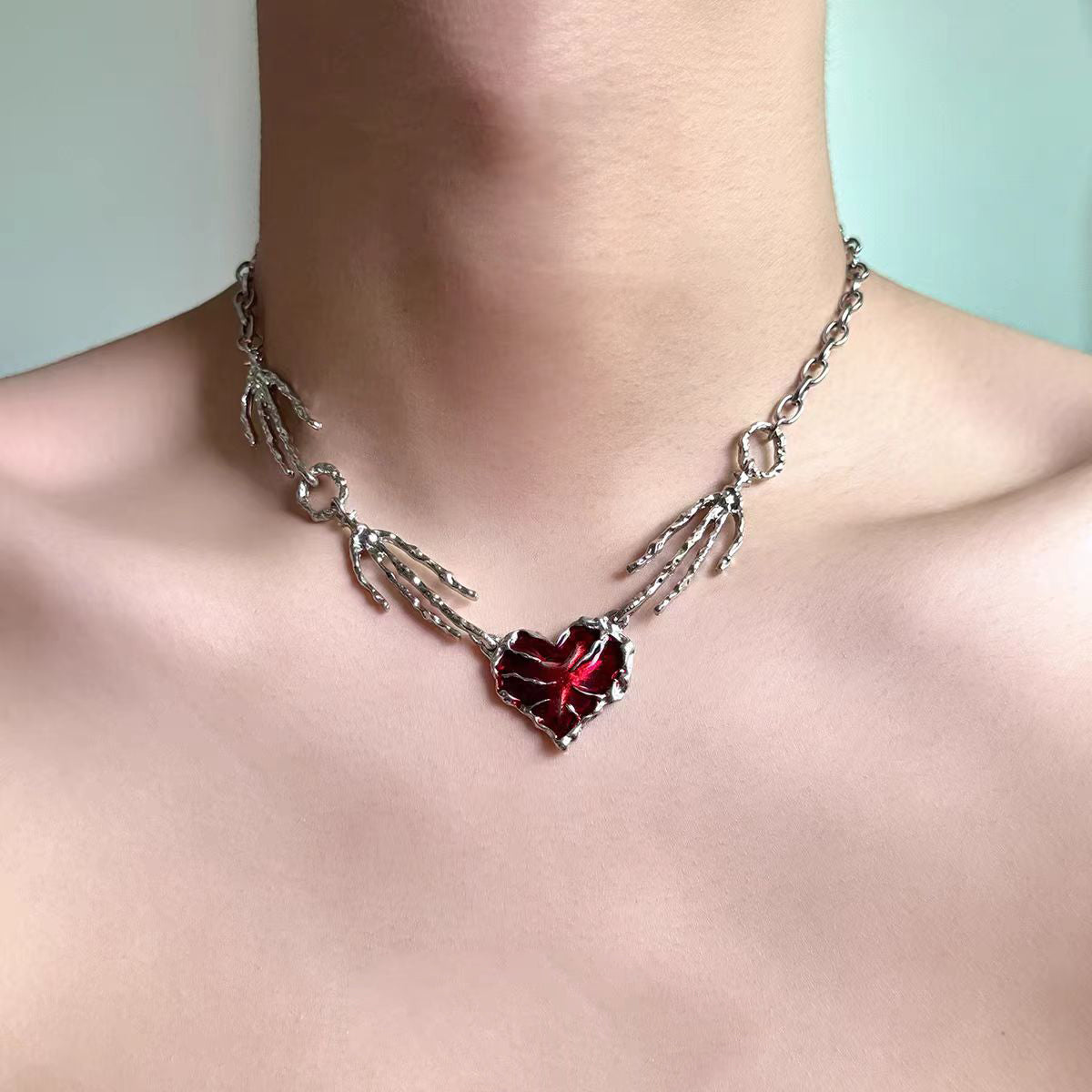 Distressed smelt metal necklace styled on unisex model with punk outfit
