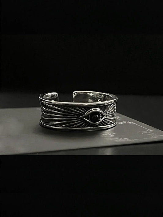 Y2K evil eye rings for men with Eye of Horus motifs, oxidized steel, and cyberpunk hieroglyphic engravings