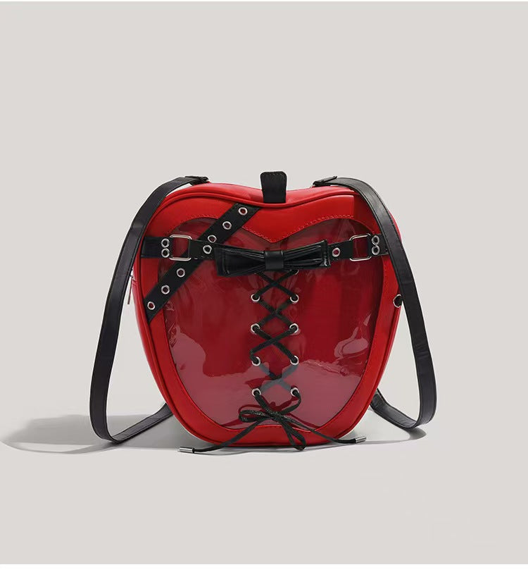 Model pairing Y2K Apple Backpack with plaid skirt and combat boots